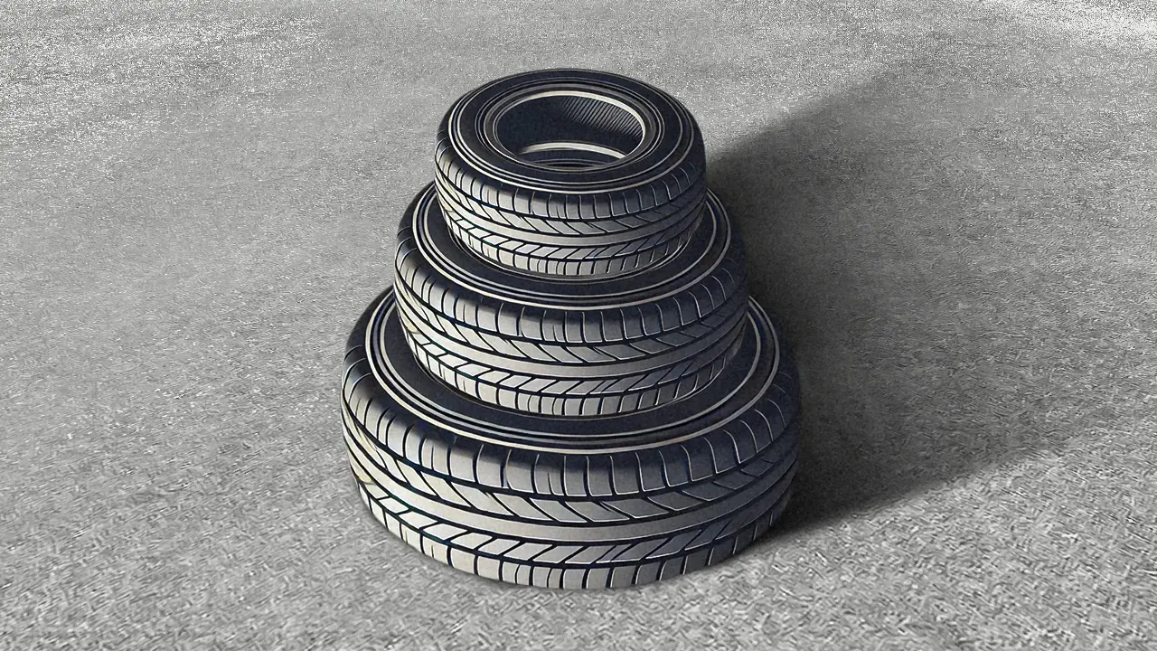 Lot de pneu empilé sur un sol en béton